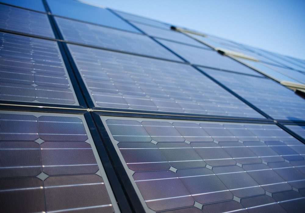 low-angle-view-of-solar-panels-against-sky.jpg